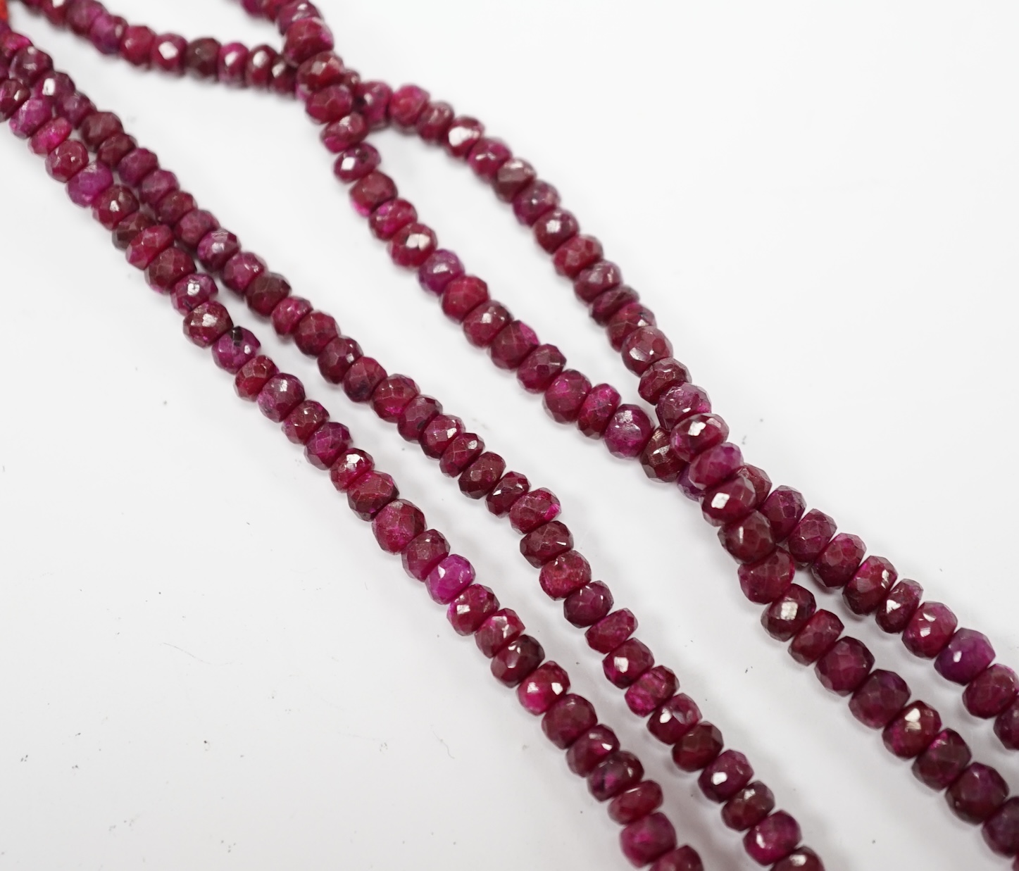 An Indian double strand facetted ruby bead necklace, ruby section only 38cm. Condition - fair